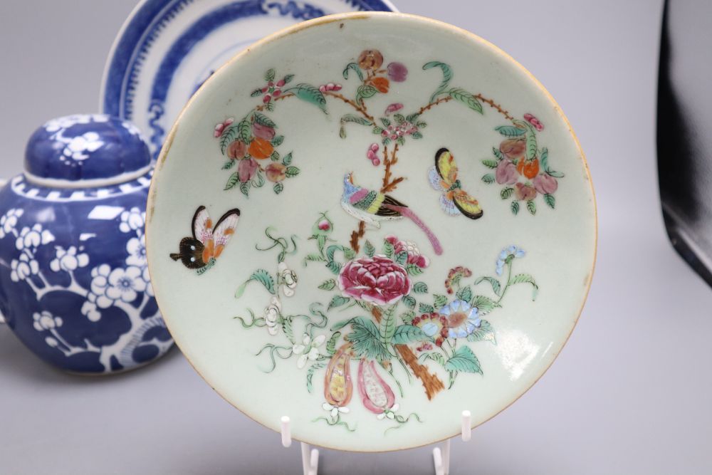 Five pieces of Chinese ceramics including two blue and white plates, a Canton plate, a blue and white mug and a prunus jar and cover,